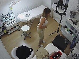 Spying on beautician changing clothes in her beauty salon Picture 7