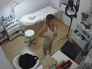 Spying on beautician changing clothes in her beauty salon Picture 8