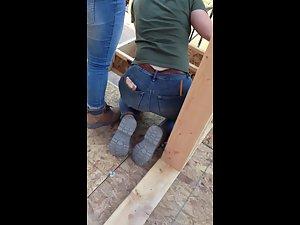 Construction worker woman bends over in jeans Picture 6