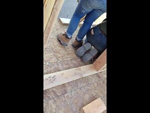 Construction worker woman bends over in jeans Picture 7