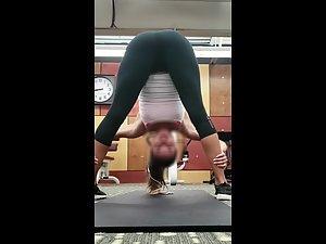 Spying on flexible girl stretching in the gym Picture 7