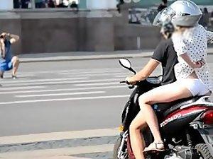 Girl on motorcycle shows some skin Picture 1