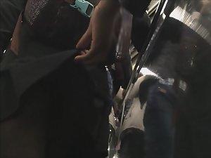 Lifting teen girl's skirt to see pantyhose