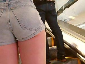 Standing close to a wedgie in denim shorts Picture 3