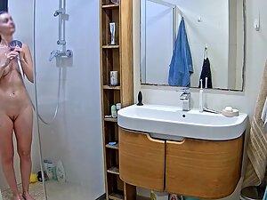 Spying on hot blonde washing her asshole in shower