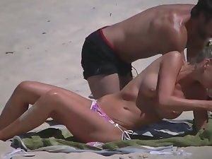 Voyeuring a topless girl's big fake tits Picture 2