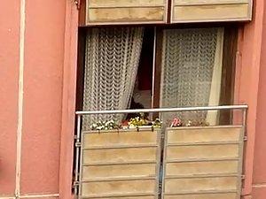 Neighbor woman shows tits on the balcony Picture 4