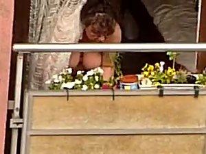 Neighbor woman shows tits on the balcony Picture 8