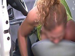 Mature lady looks for something in a car