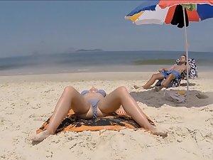 Checking out a girl that suntans with spread legs Picture 7