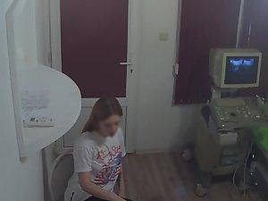 Teen reveals her titties to the doctor Picture 1