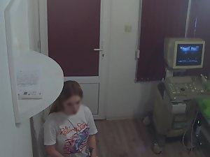 Teen reveals her titties to the doctor Picture 3