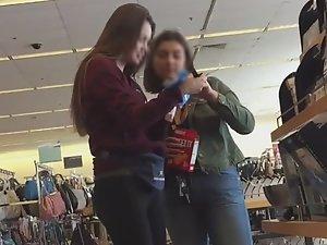 Teen friends buying bikinis together