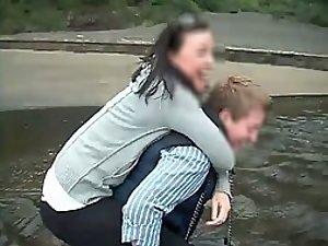 Friend pulls her pants while she's lifted