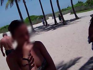Hot girl in loose bikini by the beach shower Picture 1