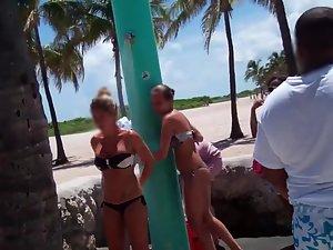 Hot girl in loose bikini by the beach shower Picture 2