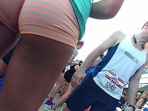 Tight brown buttocks in tiny shorts Picture 1