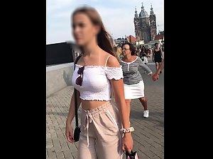 Teen shorty with a noteworthy ass in loose pants