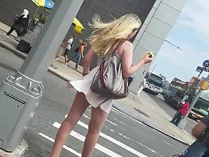 Wind raises teen girl's skirt and shows her ass
