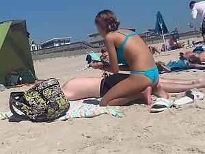 Petite girl in a very sexy pose on the beach Picture 3