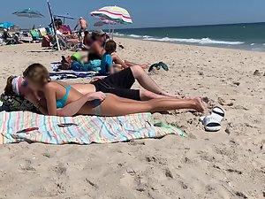 Petite girl in a very sexy pose on the beach Picture 8