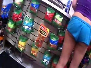 Teen girl with a nice butt picks candies Picture 4