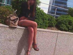 Leggy girl sitting on a wall Picture 6