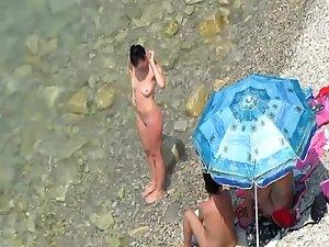 Spying a nudist family on the beach Picture 5