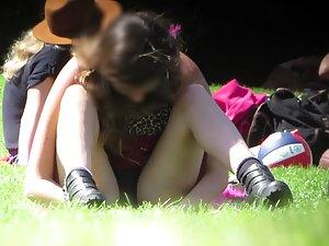 Hottie spreads legs when she sits on grass Picture 7