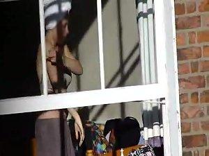 Voyeur peeps her tits through a window Picture 4