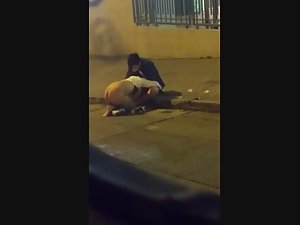 Kinky blowjob out on the street curb