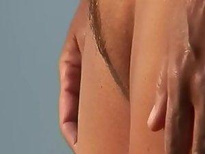 Sideways view of a nicely trimmed pussy Picture 1