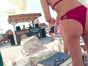Bent over view of a fun woman in red bikini Picture 4