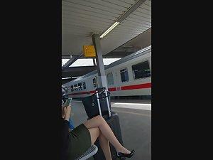 Fancy young businesswoman at train station Picture 1