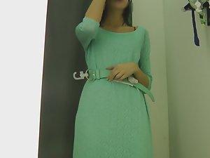 Gorgeous girl tries an elegant dress Picture 8