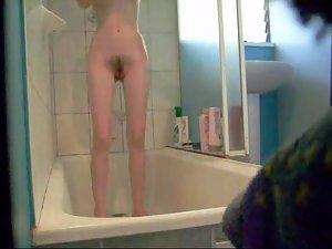Skinny girl showers and gets peeped Picture 2