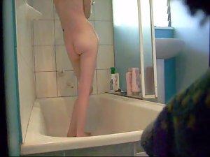Skinny girl showers and gets peeped Picture 8