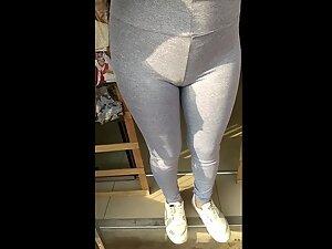 Checking out her ass and cameltoe in grey leggings