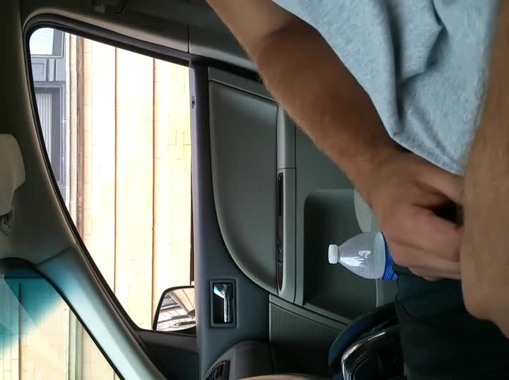 Handling his hard penis in the car