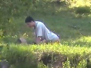 Teens fucking like rabbits in the grass Picture 1