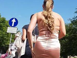 Curvy woman squeezed in tight pink dress
