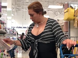 Incredible boobs of a sexy milf in the store