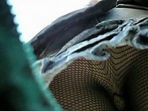 Fishnet stockings seen in an upskirt Picture 1
