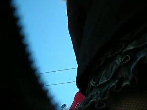 Fishnet stockings seen in an upskirt Picture 3
