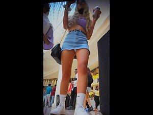 Slutty girl's miniskirt is just too short to cover her ass Picture 1