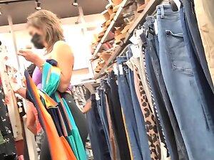 Fit girl in gym outfit is shopping for clothes Picture 2