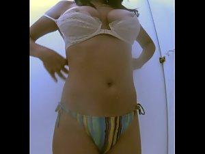Hot woman undressing her pretty bikini Picture 3
