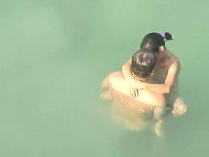Spying two teenagers fuck in the water Picture 2