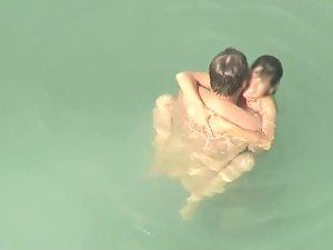 Spying two teenagers fuck in the water Picture 6