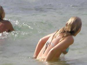 Friend pulls hot girl's bikini down Picture 4